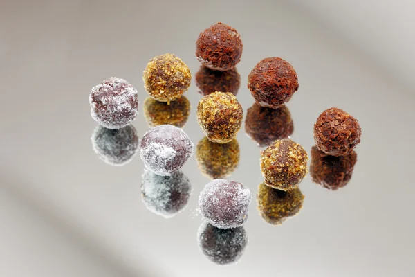 Milk chocolate praline and orange truffles — Stock Photo, Image