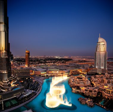 The spectacular Dubai Dancing Fountain at dusk clipart