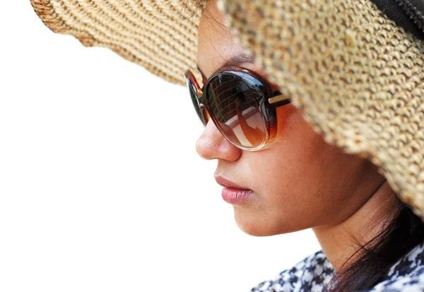 Young woman in a hat and sunglasses seating down — Stock Photo, Image
