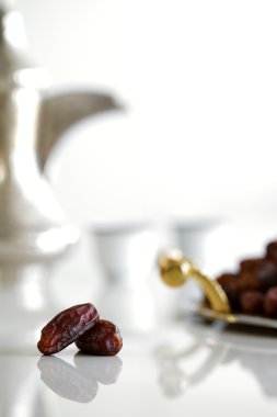 Dried dates and Arabic coffee clipart