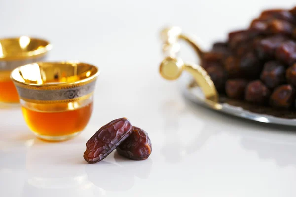 Dried dates and Arabic tea — Stockfoto