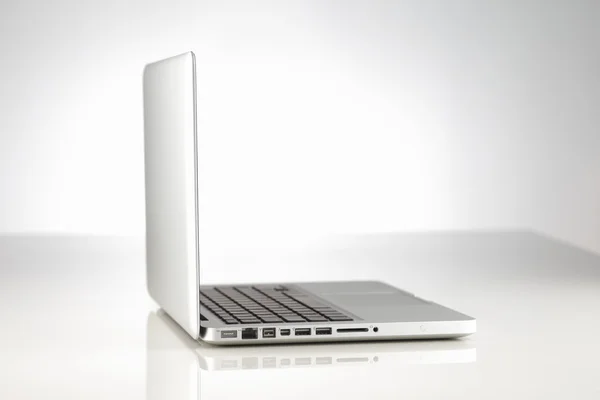 A beautifully lit modern alloy laptop computer — Stock Photo, Image