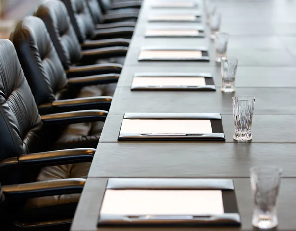 The boardroom table is set for a meeting — Stock Photo, Image