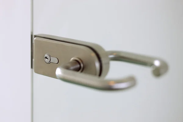 Contemporary door handle for a glass door — Stock Photo, Image