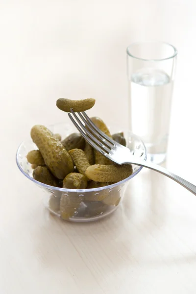 Pickled cucumber and vodka — Stock Photo, Image