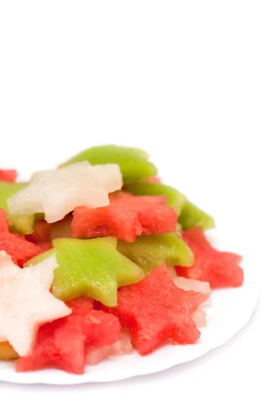 Salada de frutas com melão, melancia e kiwi em um fundo branco — Fotografia de Stock