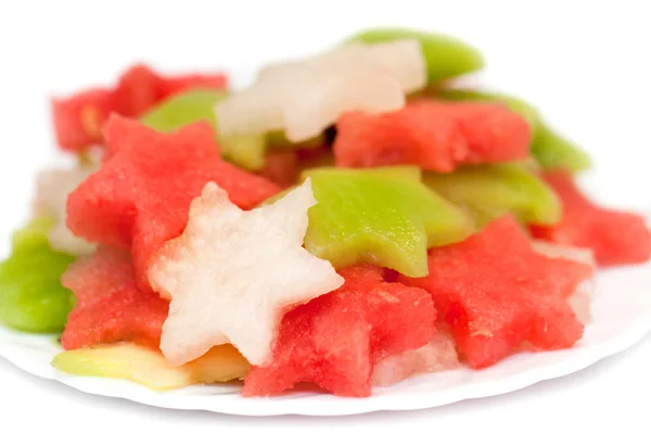 Ensalada de frutas con melón, sandía y kiwi sobre fondo blanco Imagen De Stock