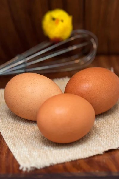 Eggs and chicken on wooden board — Stock Photo, Image