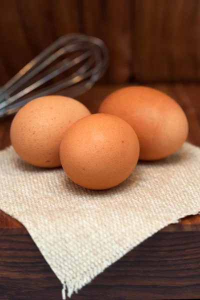 Eggs on wooden board — Stock Photo, Image