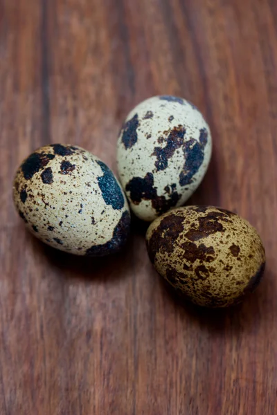 Easter still life quail egg in the basket on wooden background — Stock Photo, Image