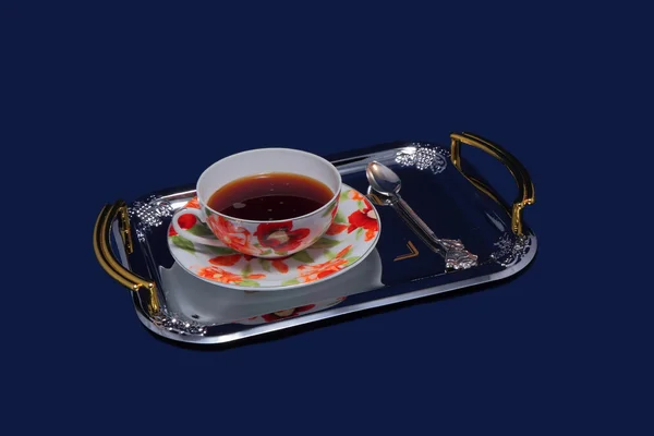 Cup and saucer and a teaspoon on the tray. — Stock Photo, Image