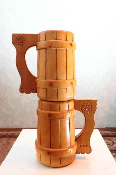 Two wooden mugs on a stool. — Stock Photo, Image