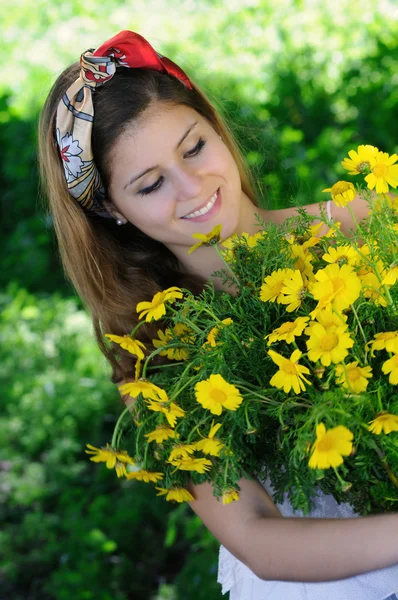 Freshly cut flowers in woman's hand — Stock Photo, Image