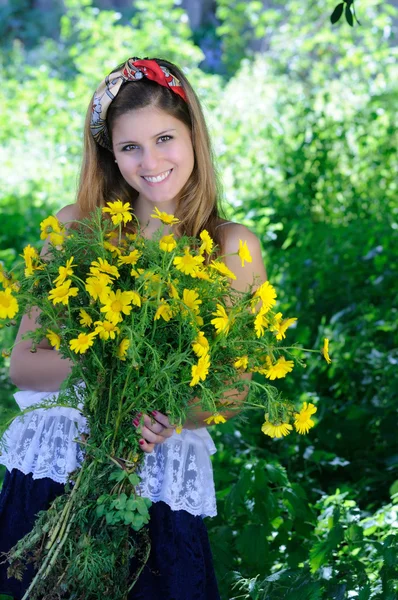 Girl holding flowers — Stock Photo, Image