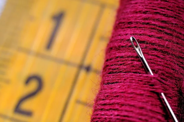 Red spool on measuring tape — Stock Photo, Image