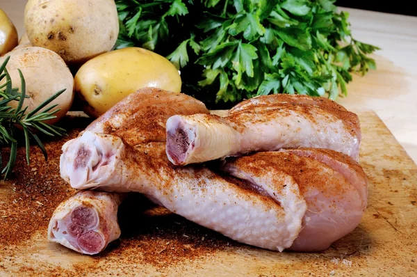 Chicken thighs on a cutting board — Stock Photo, Image