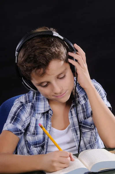Young student listening music — Stock Photo, Image