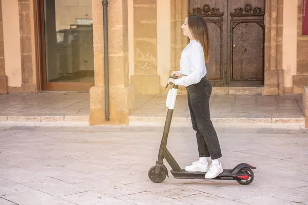 Joyful Young Woman Riding Kick Scooter Sicilian Small Town — Stock Photo, Image