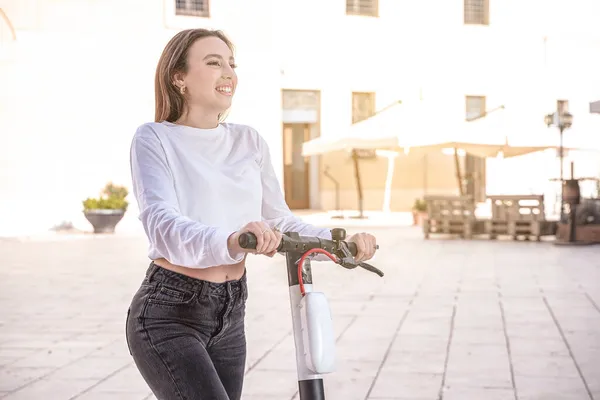 Young Woman Riding Electric Scooter Little Village Background — Stock Photo, Image
