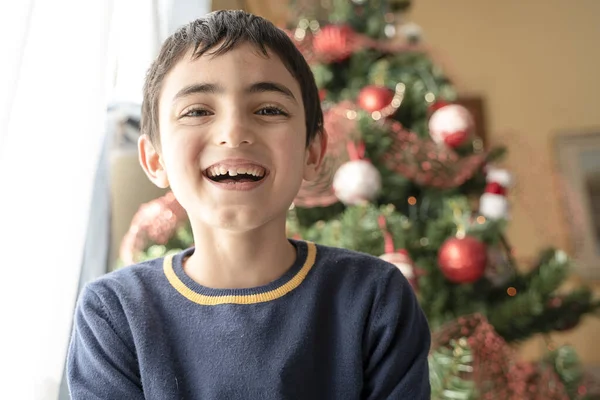 Young Boy Smiling Background Christmas Tree Home Happy Laughing Child — Stock Photo, Image