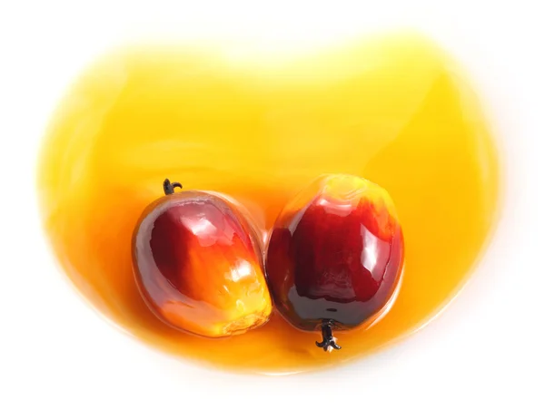 Oil palm fruit and cooking oil — Stock Photo, Image