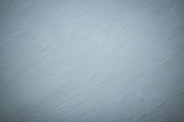 The background is a light gray wall with a gradient. texture, heterogeneous, strokes, bulge, interior