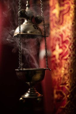 Lighted lamp in the church close-up. Church rite, Christianity, religion, cross, temple, priest, prayer, incense
