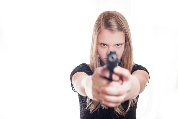 Blonde girl aiming with hand gun — Stock Photo, Image