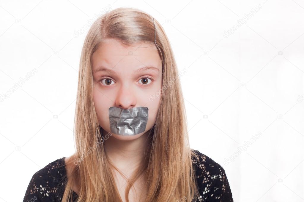 Blonde girl with tape on mouth