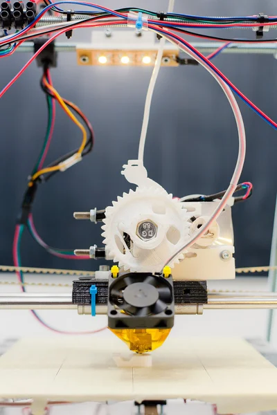 Electronic 3D plastic printer during work in school laboratory Stock Photo