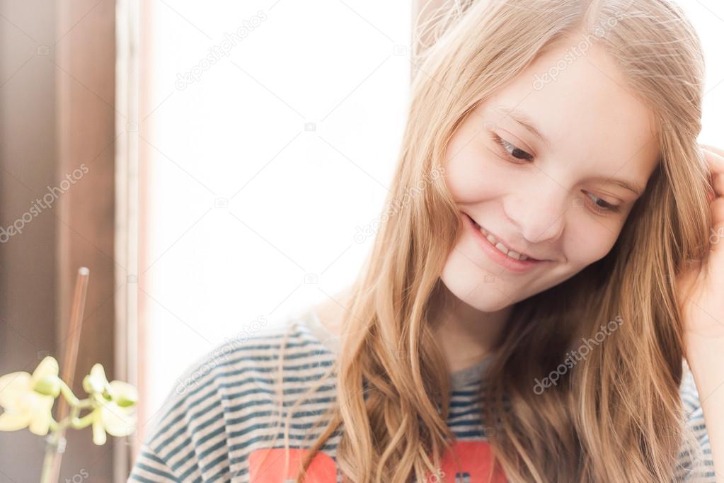 Portrait of young christian blonde girl