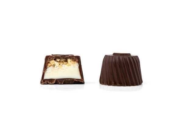 Chocolate candies with nougat and nuts isolated on white background.