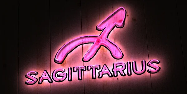 Sterrenbeeld Boogschutter in roze neon licht — Stockfoto