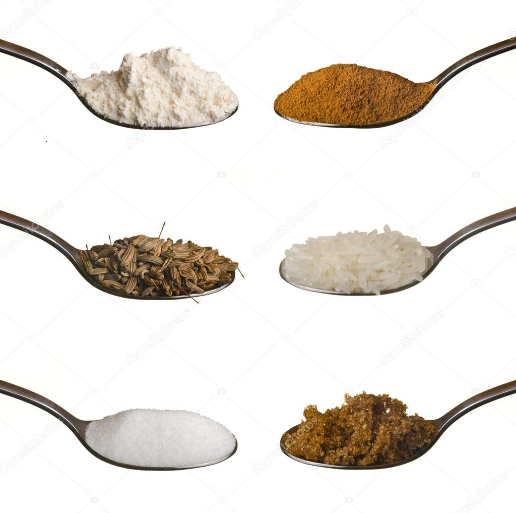 Food ingredients in spoons isolated