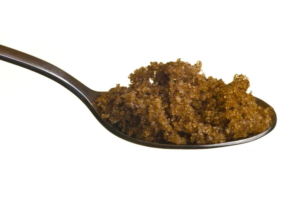 Brauner Zucker in einem Löffel — Stockfoto