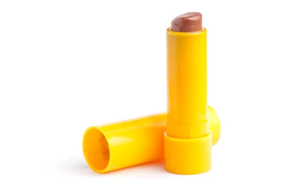 Lápiz labial rojo en contenedor amarillo — Foto de Stock