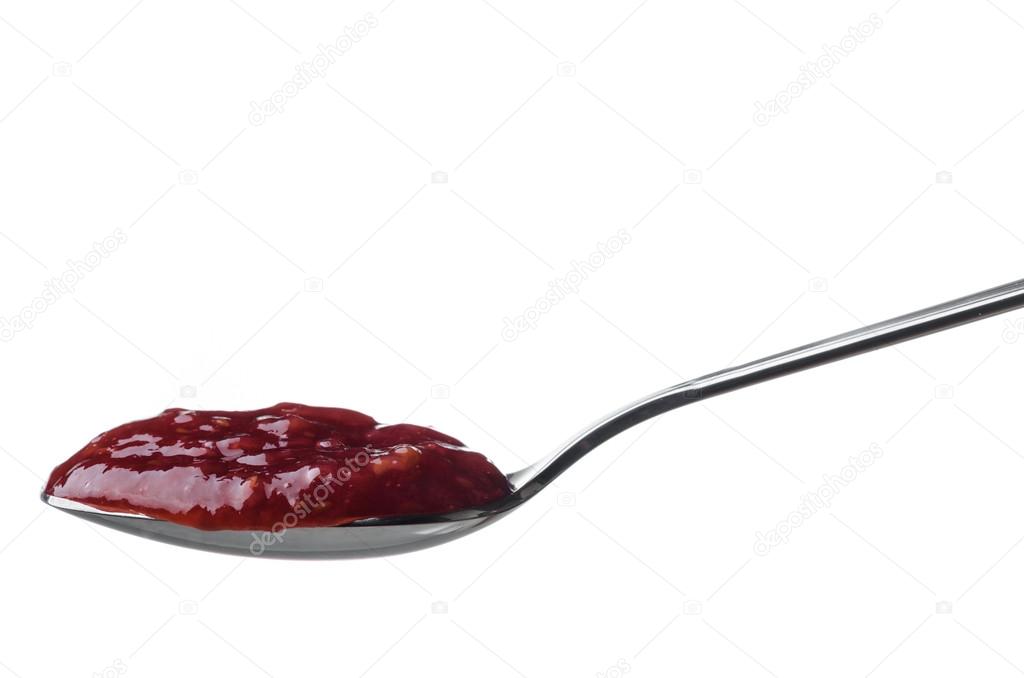 Raspberry jam in a spoon