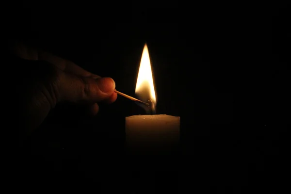 Lighting a candle — Stock Photo, Image