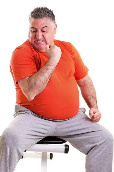 Overweight man showing his strength after doing exercises seted — Stock Photo, Image