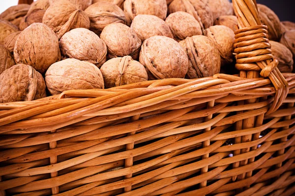 Walnuts in wicker basket — Stock Photo, Image