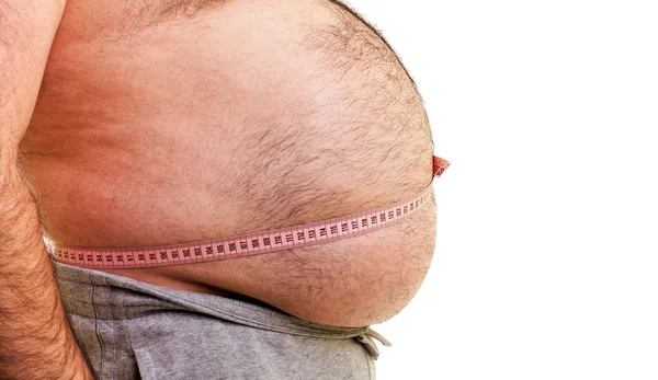 Fechar-se de uma barriga grande rodeada por uma fita métrica — Fotografia de Stock