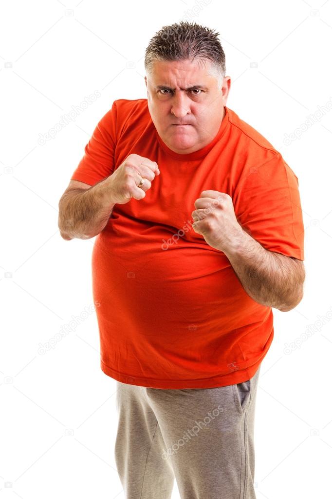 Furious man clenching his fists ready to fight