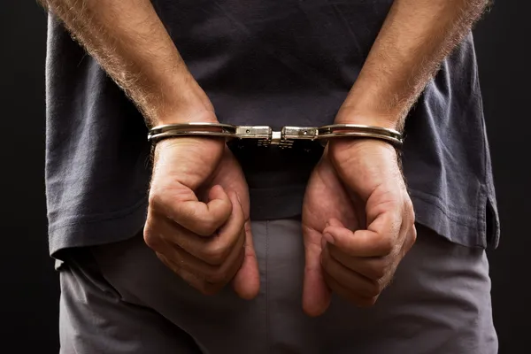 Close-up. Arrested man handcuffed — Stock Photo, Image