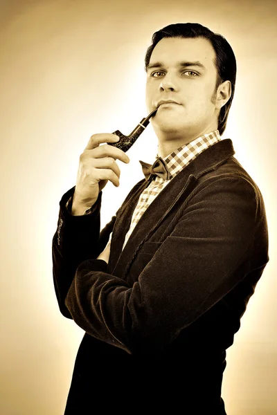 Retro portrait of a gentleman smoking pipe — Stock Photo, Image