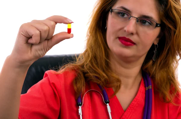 Doctor female holding a pill — Stock Photo, Image