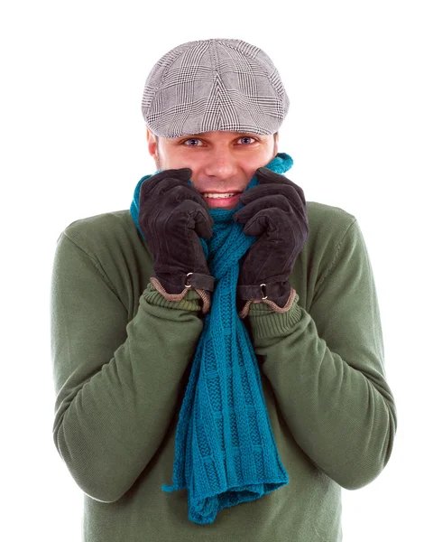 Young man with gloves and scarf shivering from cold — Stok fotoğraf