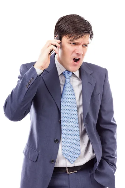 Uomo d'affari arrabbiato che parla al cellulare e urla — Foto Stock