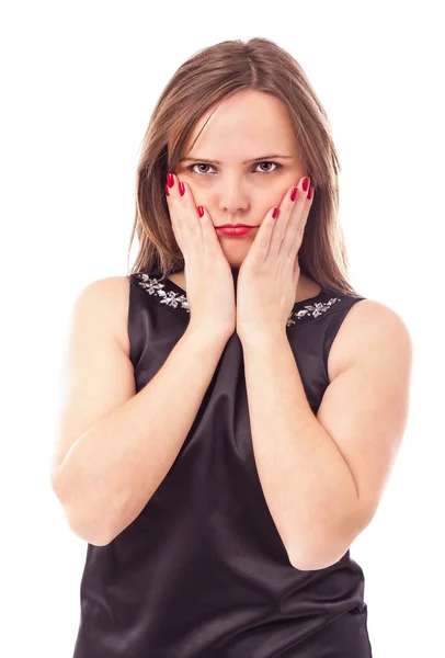 Portret van een sulky jonge vrouw haar gezicht bedrijf in handen — Stockfoto