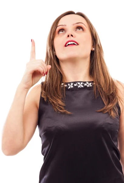 Closeup portrait of a young lady pointing up — Stock Photo, Image