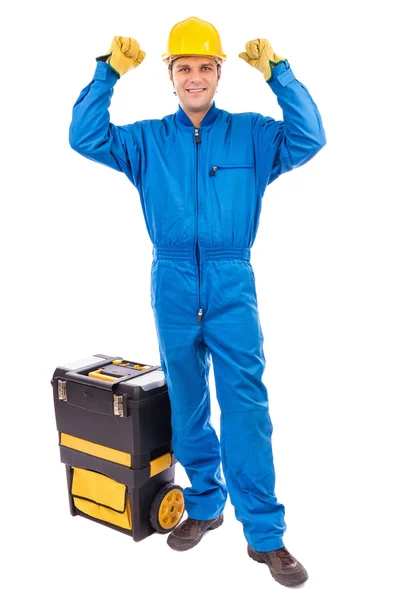 Retrato de un joven trabajador de la construcción con su caja de herramientas levantando — Foto de Stock